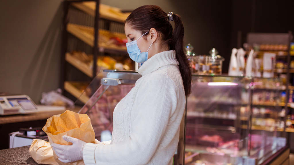 woman in bakery with mask on